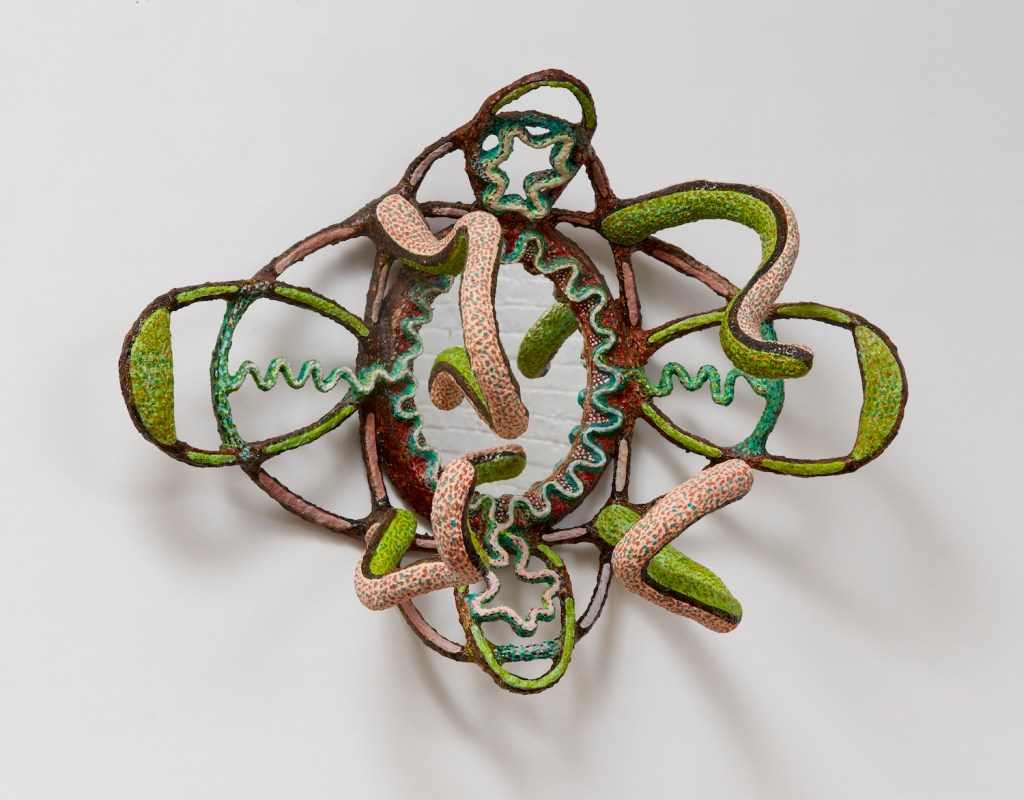 Mirror with Snakes, 2022, 29 x 23 x 15 inches, Acrylic and flashe on celuclay with mirror. Aluminum armature